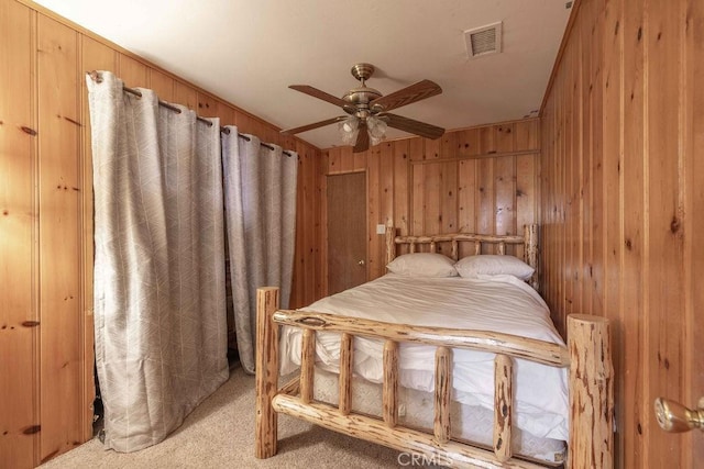 745 Sunset Ln, Sugarloaf, CA 92386 - bedroom with wooden walls, light colored carpet, and a ceiling fan