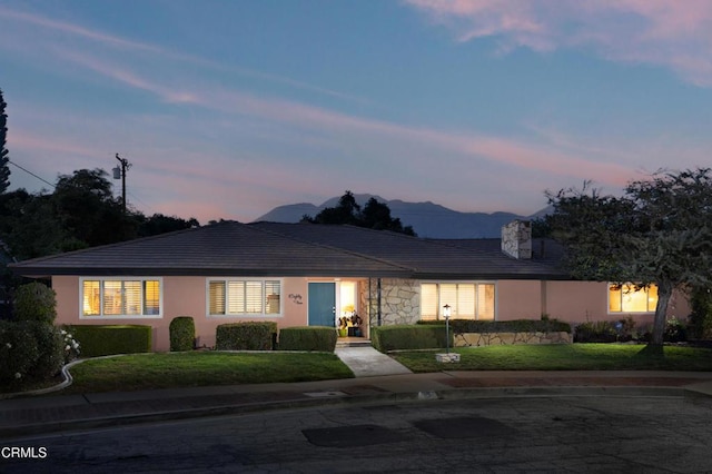 85 Gardenia Ct, Upland, CA 91786 - ranch-style house featuring a front lawn, stucco siding, and a chimney