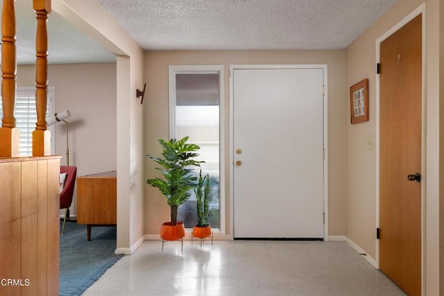 85 Gardenia Ct, Upland, CA 91786 - foyer entrance with baseboards and a textured ceiling