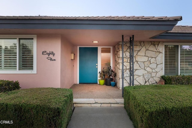 85 Gardenia Ct, Upland, CA 91786 - view of exterior entry featuring stone siding and stucco siding