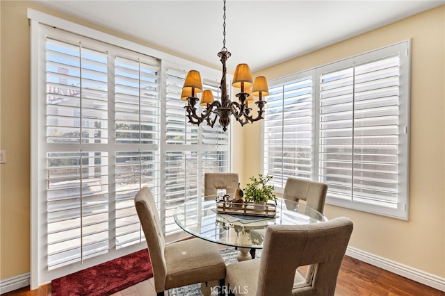 2811 N Preston St, Orange, CA 92867 - dining area with a chandelier, baseboards, healthy amount of natural light, and wood finished floors