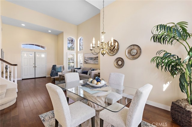 2811 N Preston St, Orange, CA 92867 - dining room with a chandelier, baseboards, a towering ceiling, dark wood-style floors, and stairs