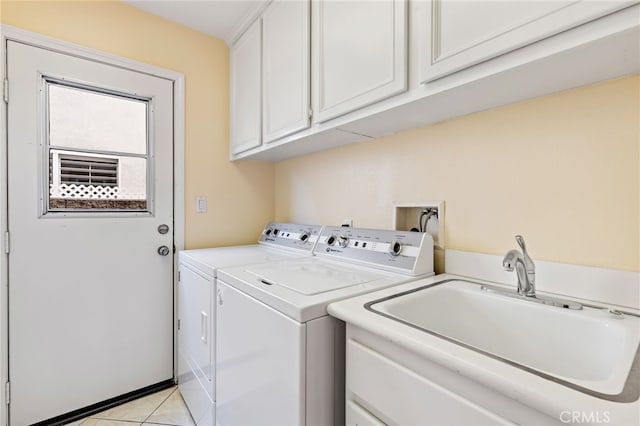 2811 N Preston St, Orange, CA 92867 - laundry room featuring washer and dryer, cabinet space, and light tile patterned floors