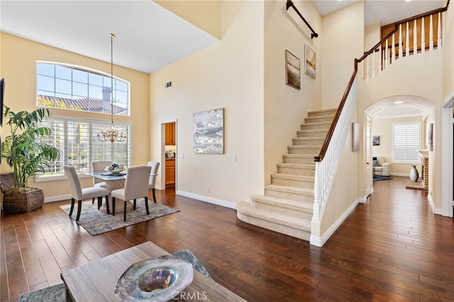2811 N Preston St, Orange, CA 92867 - foyer entrance featuring a high ceiling, a chandelier, stairway, dark wood-style floors, and baseboards