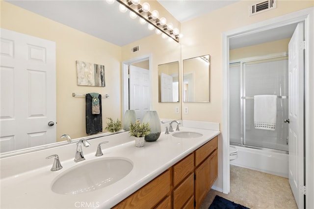 2811 N Preston St, Orange, CA 92867 - full bath with double vanity, toilet, and shower / bath combination with glass door