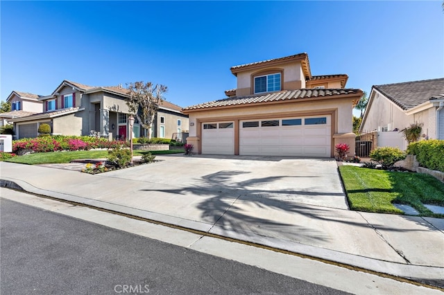 2811 N Preston St, Orange, CA 92867 - mediterranean / spanish house with stucco siding, concrete driveway, a tiled roof, and an attached garage