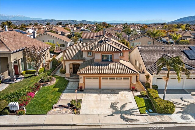 2811 N Preston St, Orange, CA 92867 - view of front of home featuring a residential view, stucco siding, concrete driveway, a tiled roof, and a mountain view
