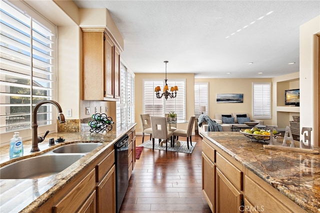 2811 N Preston St, Orange, CA 92867 - kitchen featuring a sink, black dishwasher, dark wood-type flooring, hanging light fixtures, and a chandelier
