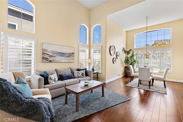 2811 N Preston St, Orange, CA 92867 - living area featuring a towering ceiling, baseboards, a chandelier, and dark wood-type flooring