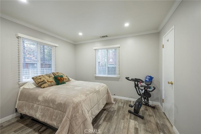 913 W Rainbow Blvd, Big Bear City, CA 92314 - bedroom with wood finished floors, multiple windows, crown molding, recessed lighting, and baseboards