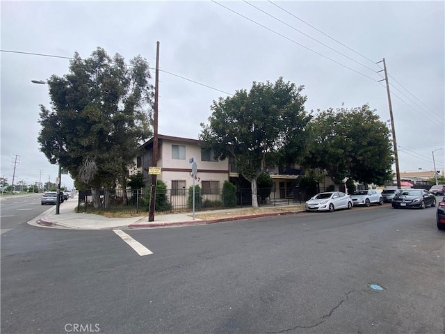 1667 W 208th St, Torrance, CA 90501 - view of asphalt road featuring sidewalks, curbs, and street lighting
