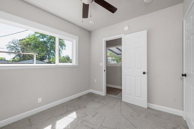 1906 N Fruit Ave, Fresno, CA 93705 - unfurnished bedroom featuring carpet, baseboards, ceiling fan, and a closet