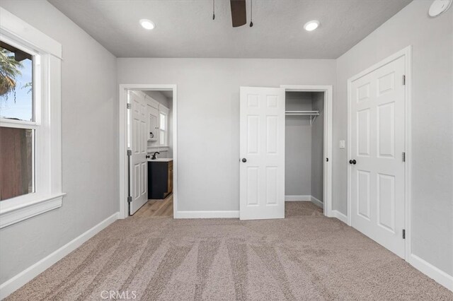 1906 N Fruit Ave, Fresno, CA 93705 - unfurnished bedroom featuring carpet, baseboards, recessed lighting, ensuite bathroom, and a closet