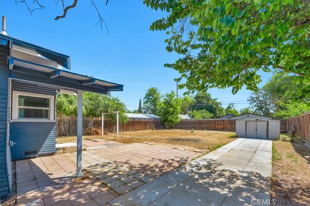 1906 N Fruit Ave, Fresno, CA 93705 - fenced backyard with a patio area