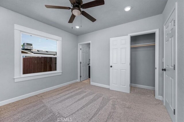 1906 N Fruit Ave, Fresno, CA 93705 - unfurnished bedroom featuring carpet floors, baseboards, a closet, recessed lighting, and a ceiling fan