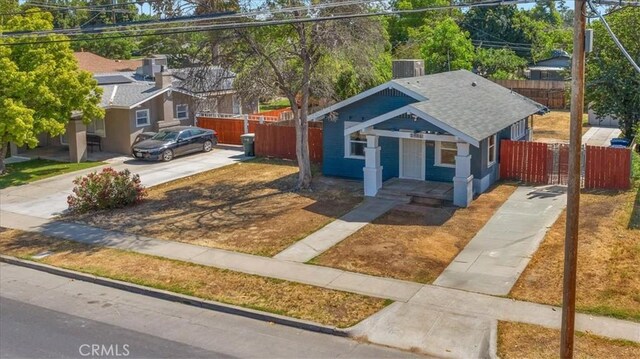 1906 N Fruit Ave, Fresno, CA 93705 - bungalow-style home with driveway, roof with shingles, and a porch