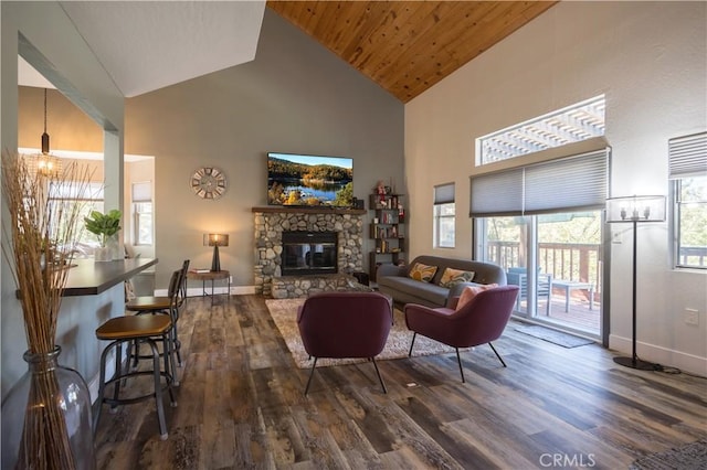 1315 Sequoia Dr, Lake Arrowhead, CA 92352 - living room featuring high vaulted ceiling, dark wood-style flooring, baseboards, a stone fireplace, and wooden ceiling
