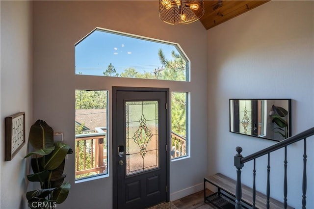 1315 Sequoia Dr, Lake Arrowhead, CA 92352 - entryway featuring vaulted ceiling, baseboards, wood finished floors, and stairs