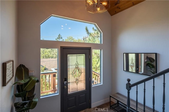 1315 Sequoia Dr, Lake Arrowhead, CA 92352 - foyer with healthy amount of natural light, vaulted ceiling, and stairway