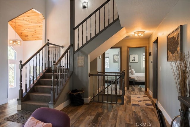 1315 Sequoia Dr, Lake Arrowhead, CA 92352 - stairway featuring wood finished floors and a chandelier