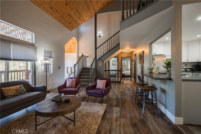 1315 Sequoia Dr, Lake Arrowhead, CA 92352 - living room featuring high vaulted ceiling, stairway, dark wood-type flooring, baseboards, and wood ceiling