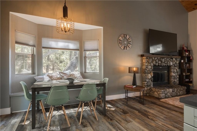1315 Sequoia Dr, Lake Arrowhead, CA 92352 - dining space with wood finished floors, a chandelier, baseboards, a fireplace, and lofted ceiling