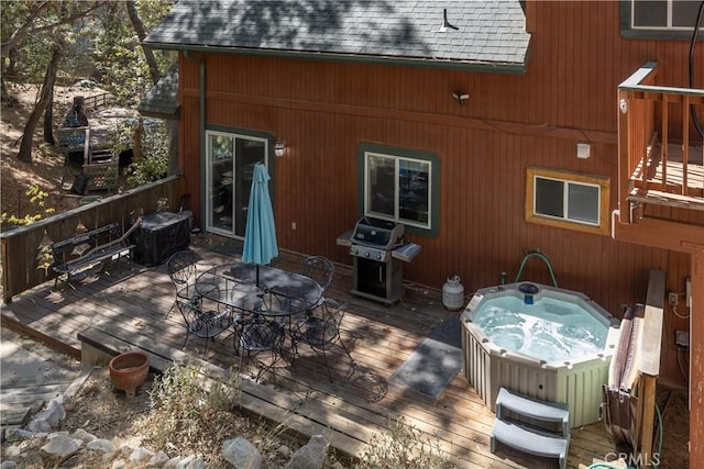 1315 Sequoia Dr, Lake Arrowhead, CA 92352 - wooden terrace with a hot tub, a grill, and outdoor dining area