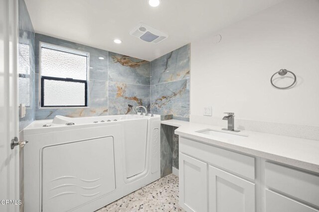 1194 Kingston Ln, Ventura, CA 93001 - bathroom with a bath, recessed lighting, vanity, and speckled floor