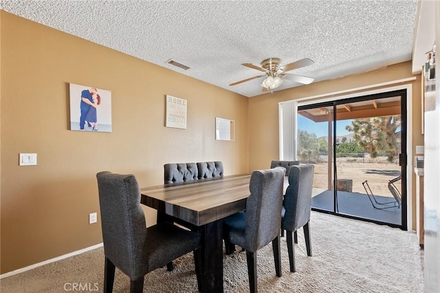 8600 San Vicente Dr, Yucca Valley, CA 92284 - carpeted dining area featuring a ceiling fan, a textured ceiling, and baseboards