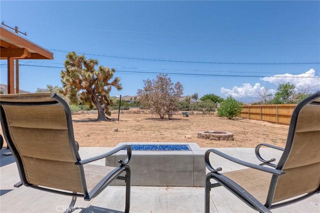 8600 San Vicente Dr, Yucca Valley, CA 92284 - view of patio / terrace with an outdoor fire pit
