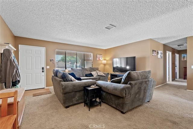8600 San Vicente Dr, Yucca Valley, CA 92284 - living room featuring light colored carpet and a textured ceiling