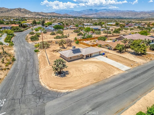 8600 San Vicente Dr, Yucca Valley, CA 92284 - aerial perspective of suburban area with a mountainous background