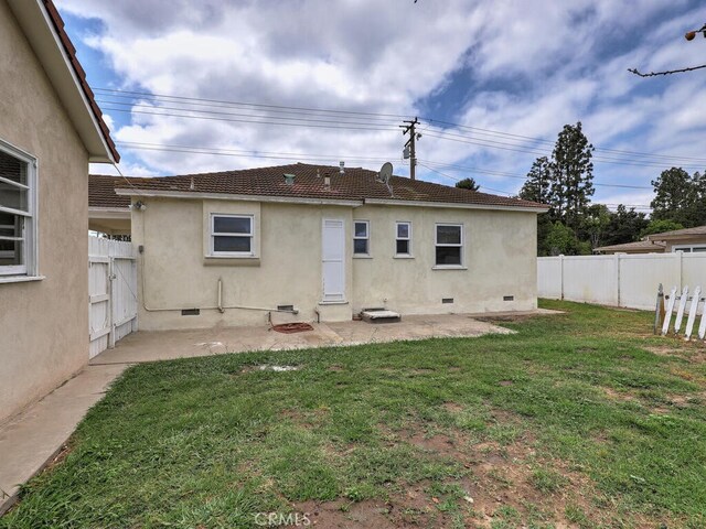 4265 Crescent Ave, Cypress, CA 90630 - rear view of property with crawl space, stucco siding, and a patio