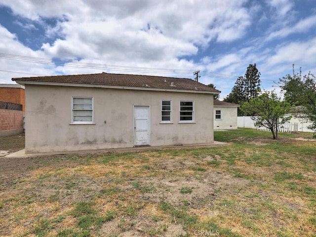 4265 Crescent Ave, Cypress, CA 90630 - rear view of house featuring stucco siding and a tile roof