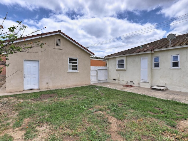 4265 Crescent Ave, Cypress, CA 90630 - rear view of property with stucco siding and a patio area