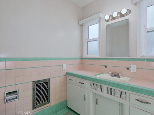 4265 Crescent Ave, Cypress, CA 90630 - bathroom with vanity, tile walls, and a wainscoted wall