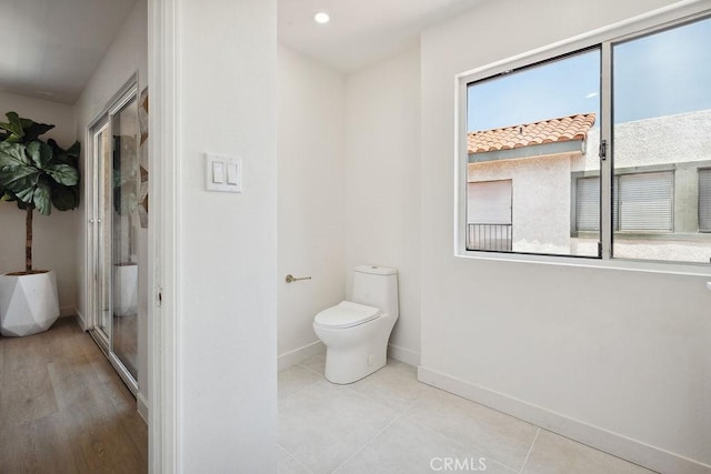 6101 Fulton Ave Unit 8, Van Nuys, CA 91401 - bathroom with baseboards, plenty of natural light, toilet, and recessed lighting