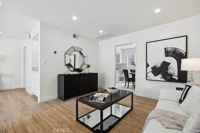 6101 Fulton Ave Unit 8, Van Nuys, CA 91401 - living area featuring light wood-style flooring, recessed lighting, and baseboards