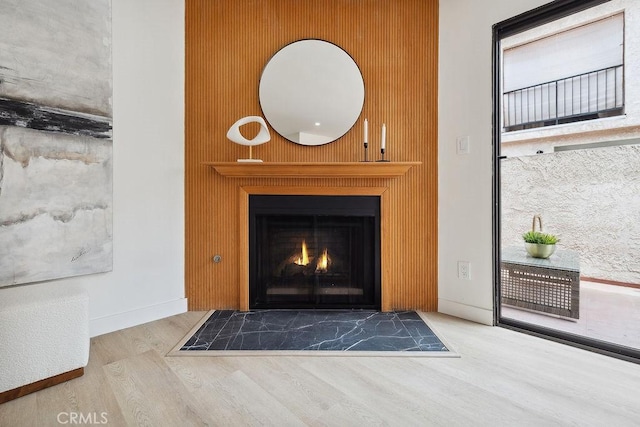 6101 Fulton Ave Unit 8, Van Nuys, CA 91401 - detailed view of wood finished floors, a fireplace with flush hearth, and baseboards