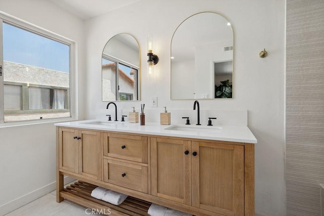 6101 Fulton Ave Unit 8, Van Nuys, CA 91401 - full bath featuring double vanity, tile patterned flooring, and baseboards