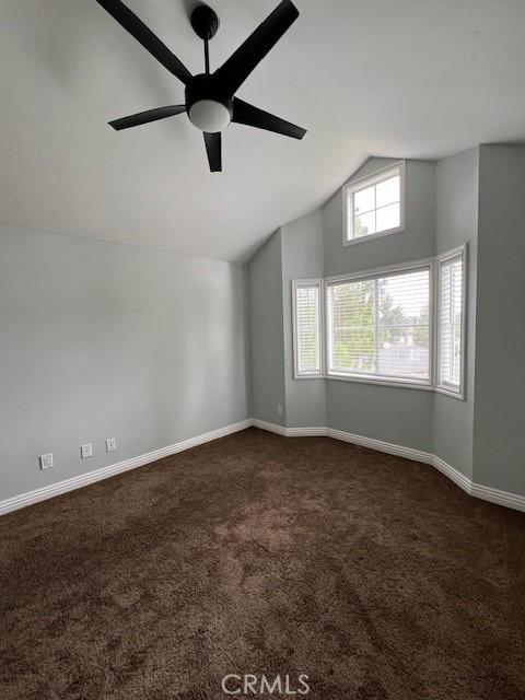 2015 Lakeridge Cir Unit 301, Chula Vista, CA 91913 - spare room with dark carpet, lofted ceiling, ceiling fan, and baseboards