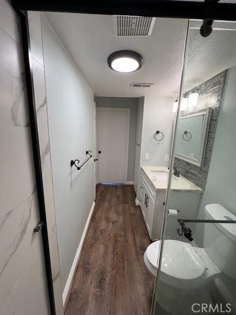 2015 Lakeridge Cir Unit 301, Chula Vista, CA 91913 - bathroom with toilet, vanity, and wood finished floors