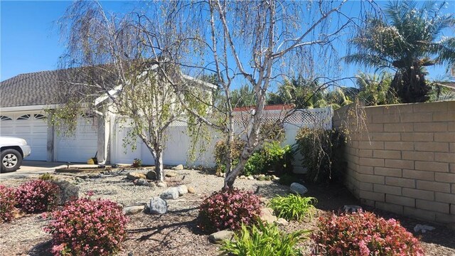 20392 Densmore Ln, Huntington Beach, CA 92646 - view of home's exterior featuring a garage and driveway