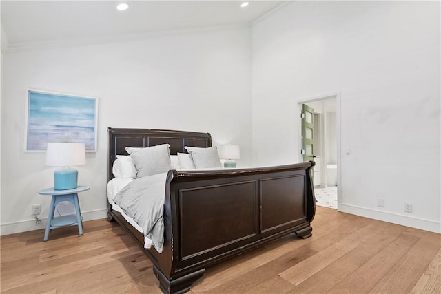 116 E Yale Loop Unit 9, Irvine, CA 92604 - bedroom featuring ornamental molding, light wood-style floors, recessed lighting, ensuite bathroom, and a high ceiling