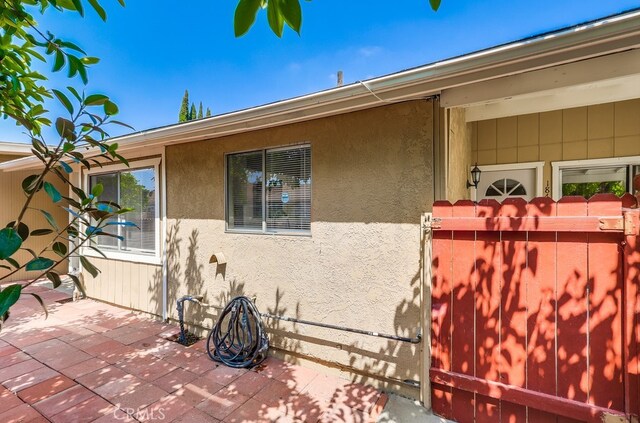 18417 Santar St, Rowland Heights, CA 91748 - view of home's exterior featuring stucco siding and a patio area