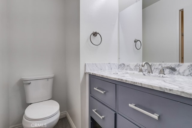18417 Santar St, Rowland Heights, CA 91748 - half bath featuring vanity, toilet, and baseboards