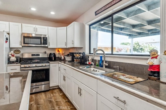 33206 Churchill St, Lake Elsinore, CA 92530 - kitchen with stainless steel appliances, white cabinetry, and recessed lighting