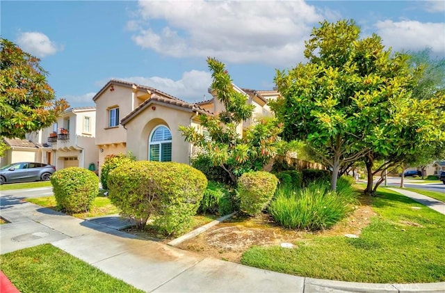 1330 W Marigold Ave, La Habra, CA 90631 - mediterranean / spanish-style house with stucco siding, a tile roof, and a front lawn