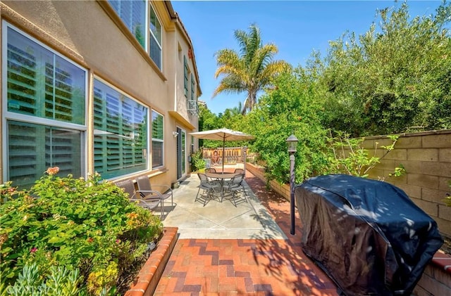 1330 W Marigold Ave, La Habra, CA 90631 - fenced backyard featuring a grill, outdoor dining space, and a patio