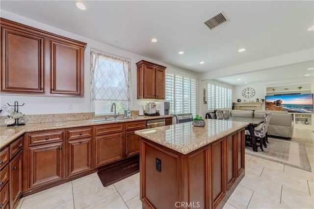 1330 W Marigold Ave, La Habra, CA 90631 - kitchen featuring a sink, open floor plan, a kitchen island, light stone countertops, and light tile patterned flooring